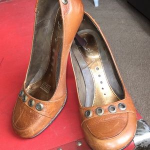 Leather 2 1/2 inch heel.